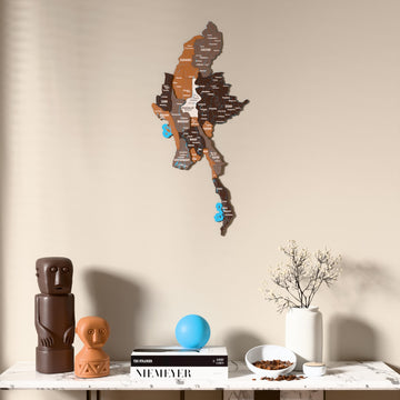 Soil Myanmar wooden wall map above a marble console, front view