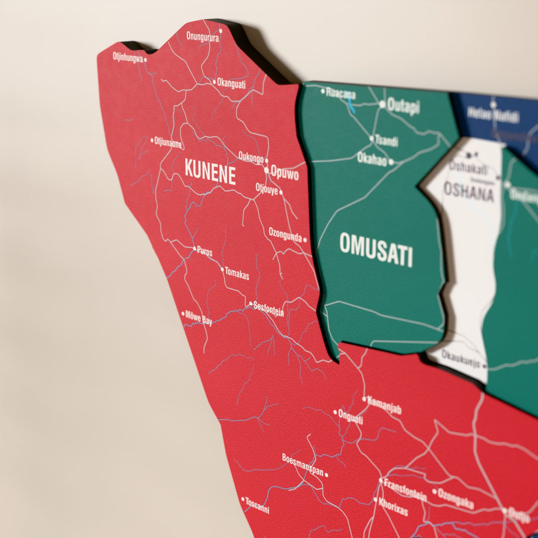 Close-up of the Flag colored Namibia wooden wall map with layered regions and printed names