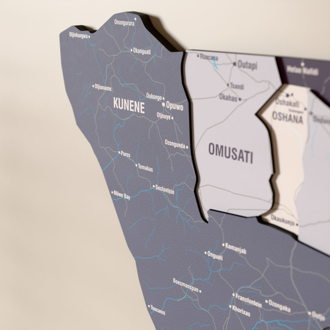 Close-up of the Nimbus Namibia wooden wall map with layered regions and printed names