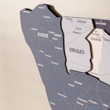 Close-up of the Nimbus Namibia wooden wall map with layered regions and printed names