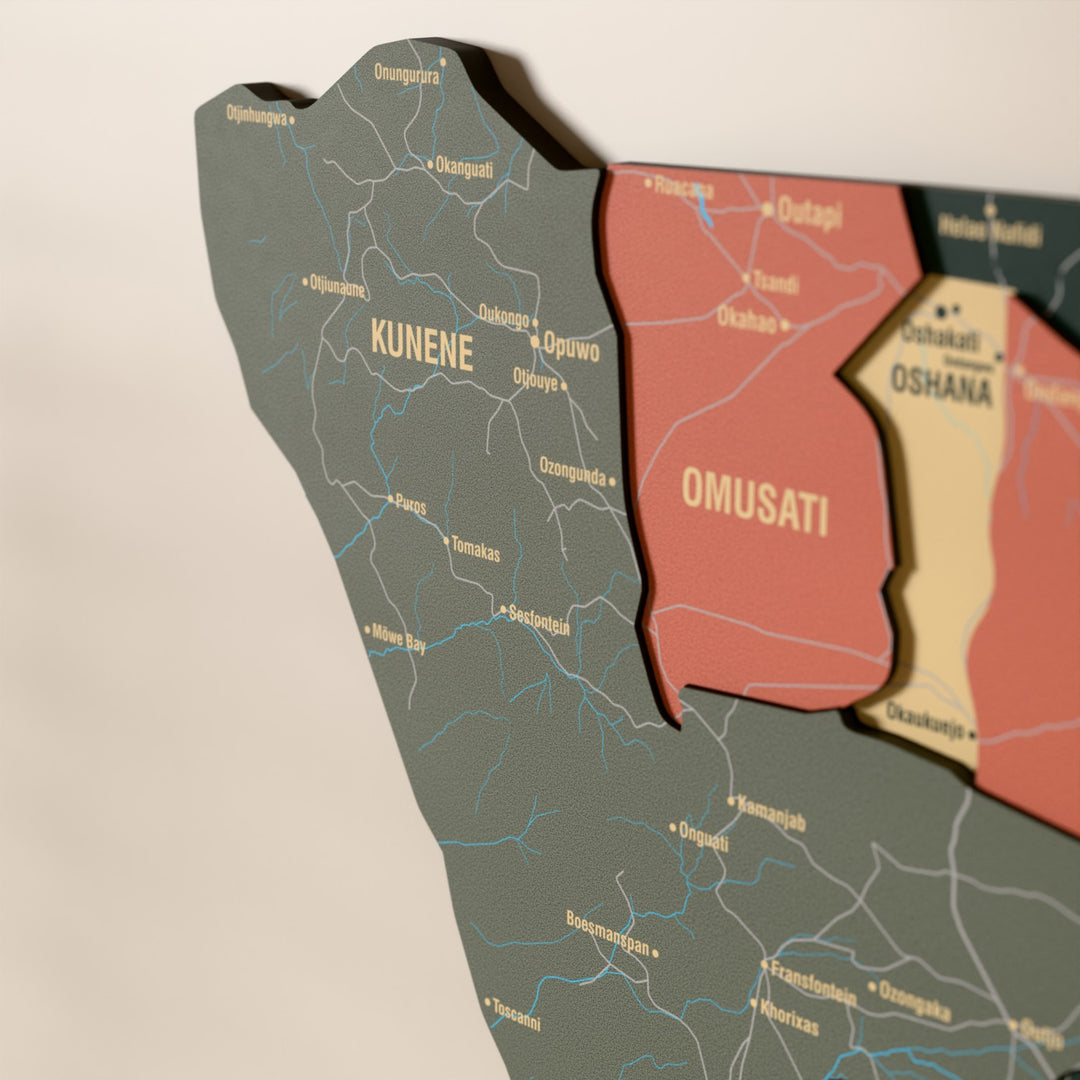 Close-up of the Sage Namibia wooden wall map with layered regions and printed names