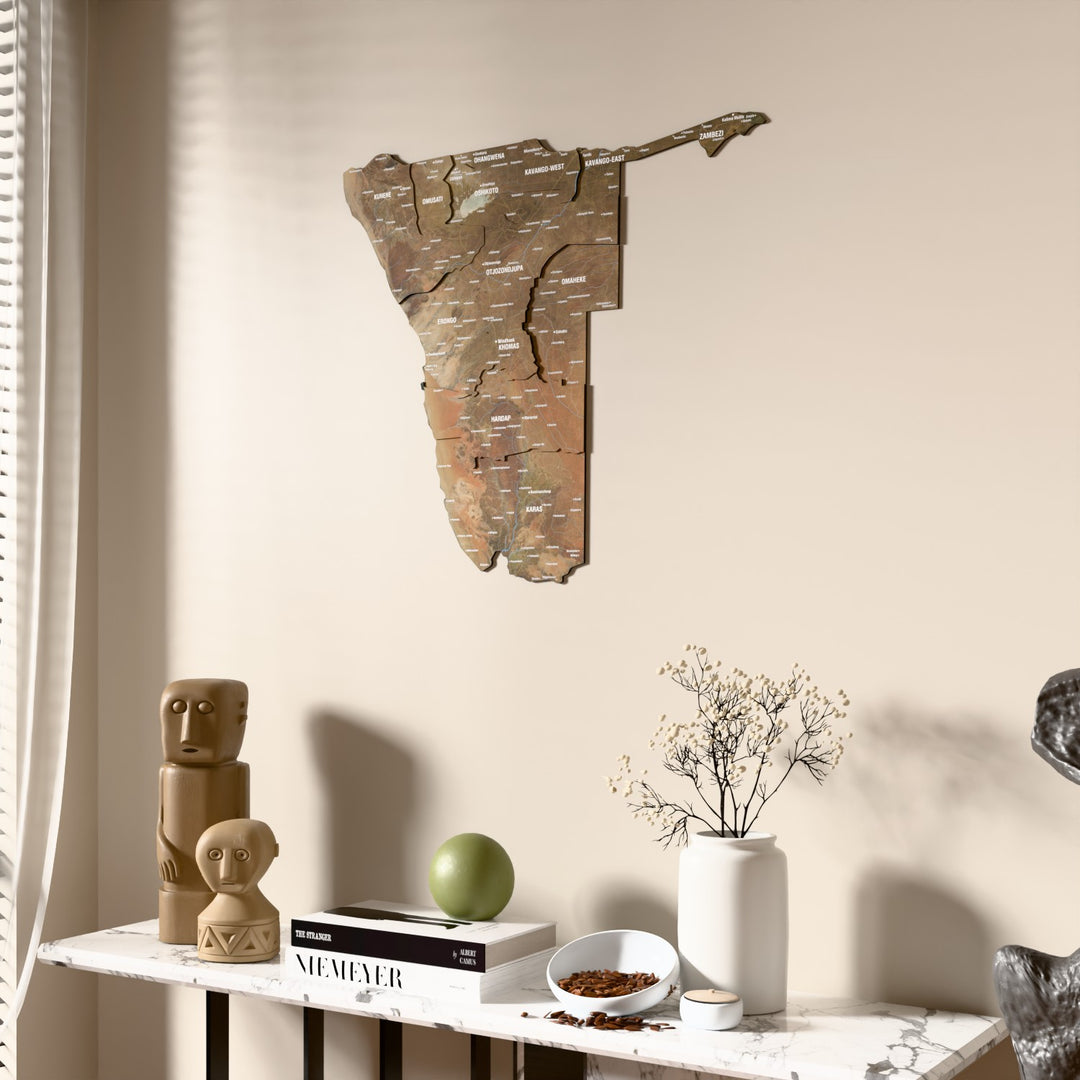 Satellite Namibia wooden wall map beside a sheer curtain, angled view