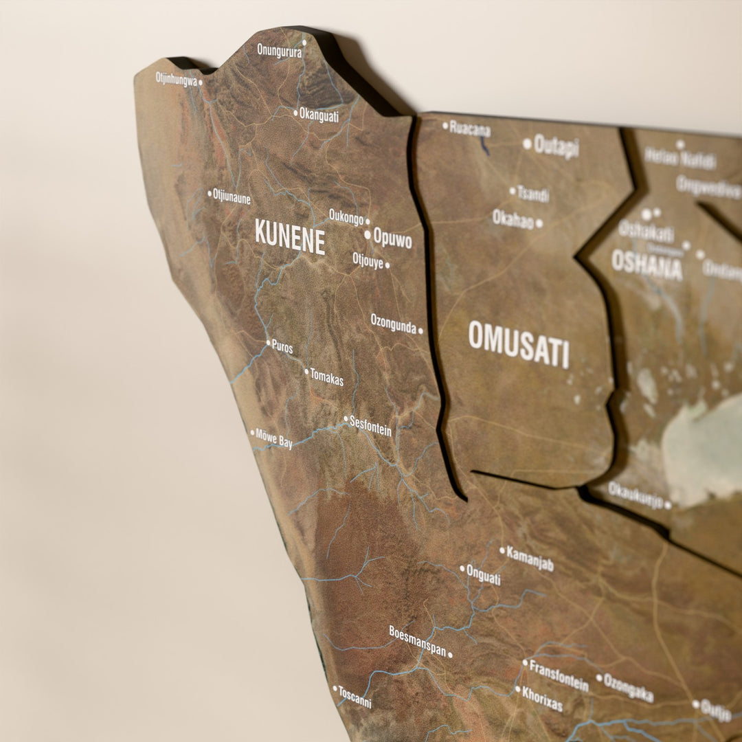 Close-up of the Satellite Namibia wooden wall map with layered regions and printed names