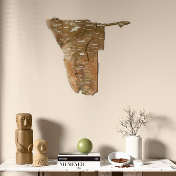 Satellite Namibia wooden wall map above a marble console, front view
