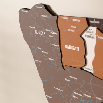 Close-up of the Soil Namibia wooden wall map with layered regions and printed names