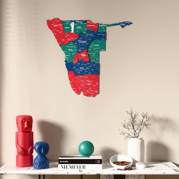 Flag colored Namibia wooden wall map above a marble console, front view