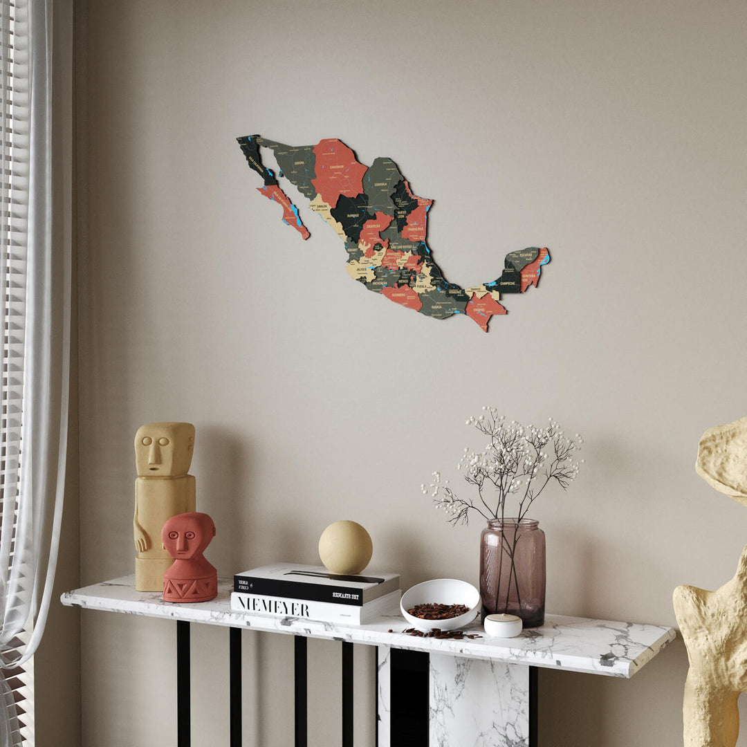 Sage Mexico wooden wall map in dark green, tan and salmon states above a marble console table, sheer curtain at the left