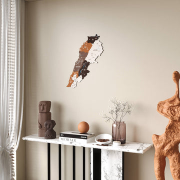 Soil Lebanon wooden wall map in caramel, mocha and chocolate tones, above a console beside a curtain