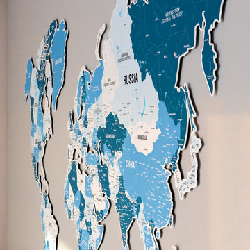 Side-angle close-up of Asia on the Navy metal world map, showing Russia, Mongolia and China