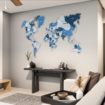 Navy metal world map with states above a dark console in a living room, wide view