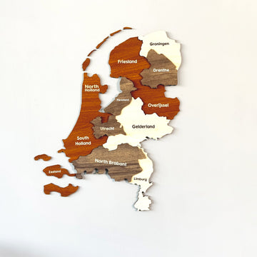 3D wooden Netherlands map with province names in orange-brown, taupe and cream, with the Zeeland islands as separate pieces
