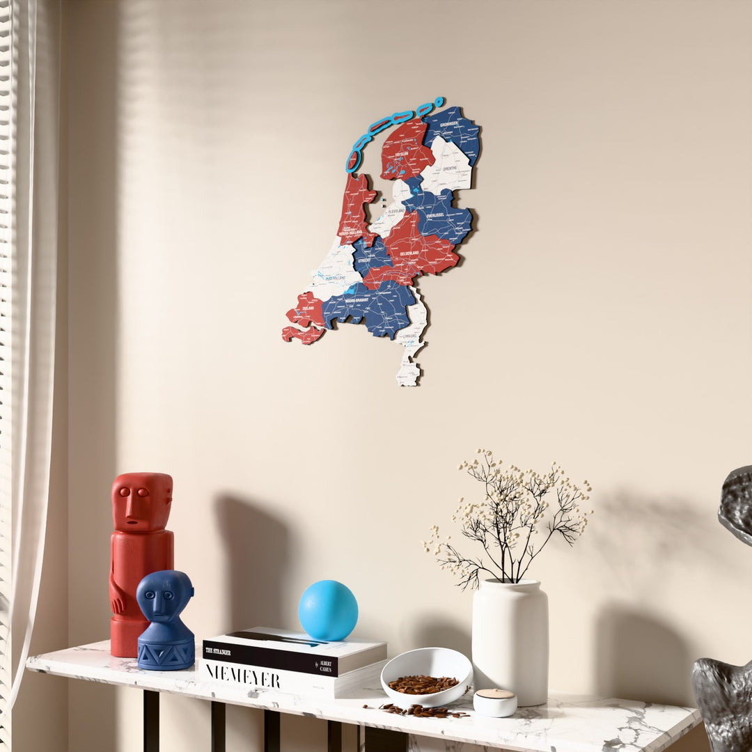 Flag colored Netherlands wooden wall map beside a sheer curtain, angled view