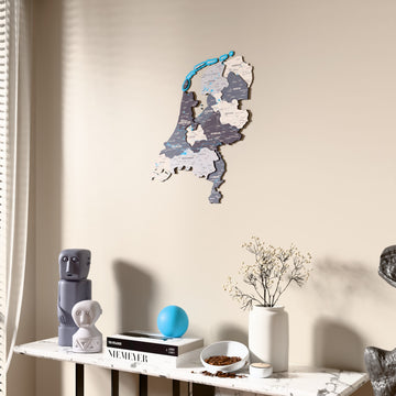Nimbus Netherlands wooden wall map beside a sheer curtain, angled view
