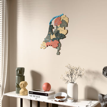 Sage Netherlands wooden wall map beside a sheer curtain, angled view