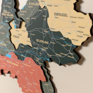 Close-up of the Sage Netherlands wooden wall map with layered regions and printed names