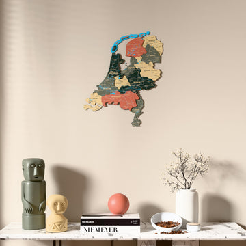 Sage Netherlands wooden wall map above a marble console, front view