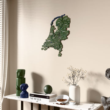 Satellite Netherlands wooden wall map beside a sheer curtain, angled view