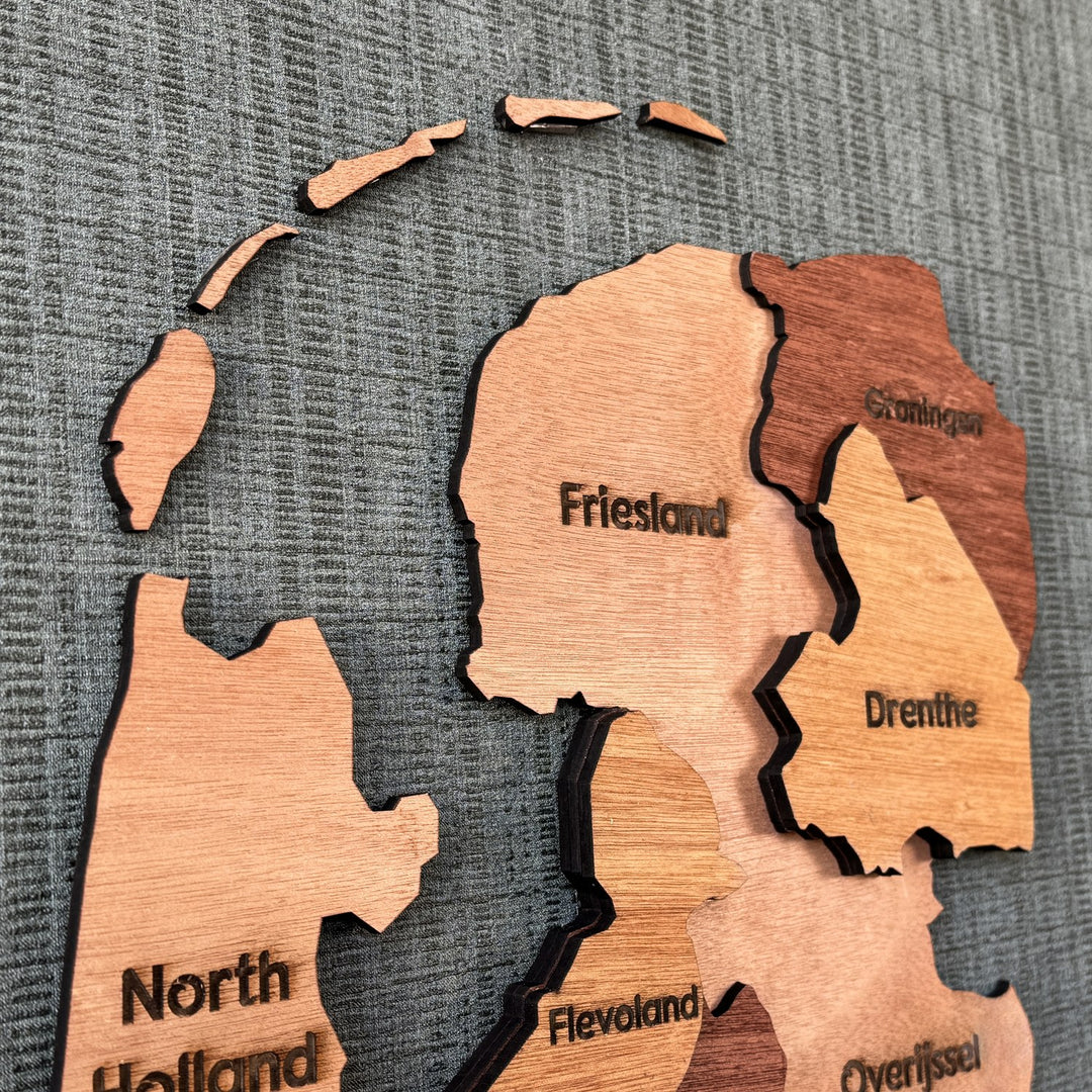 Close-up of Friesland, Groningen and Drenthe layers on the wooden Netherlands map