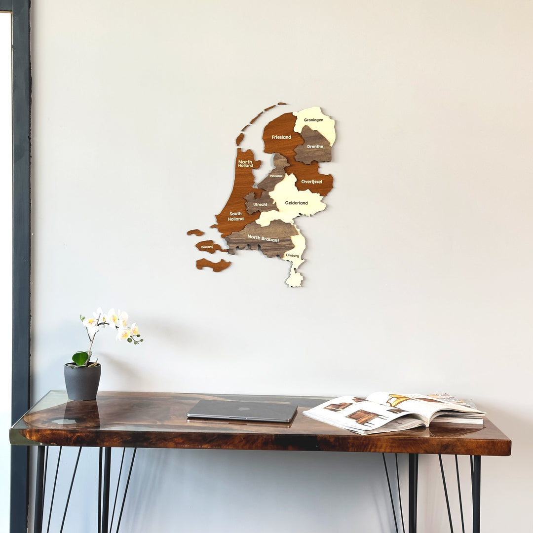 Netherlands wooden wall map above the corner of a dark desk
