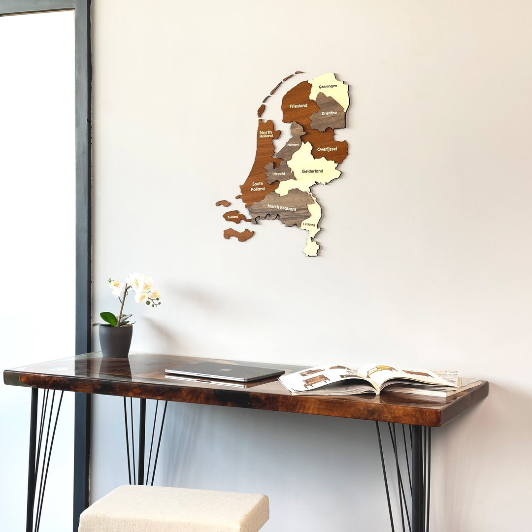 Netherlands wooden wall map close view above a resin-topped desk