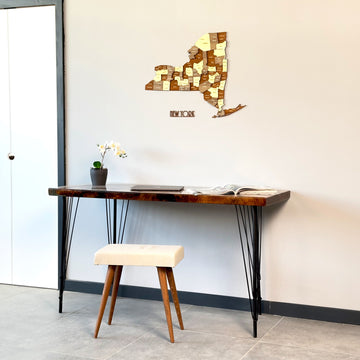 New York wooden wall map with NEW YORK lettering above a live-edge desk, wide view