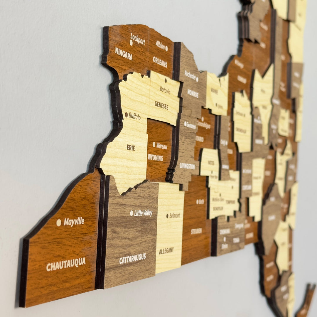 Angled close-up of the wooden New York map showing Niagara, Erie, Chautauqua and Allegany county layers