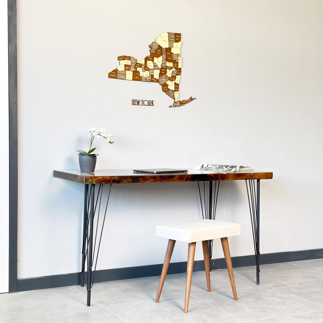 New York wooden wall map with name lettering, wide view above a slim desk