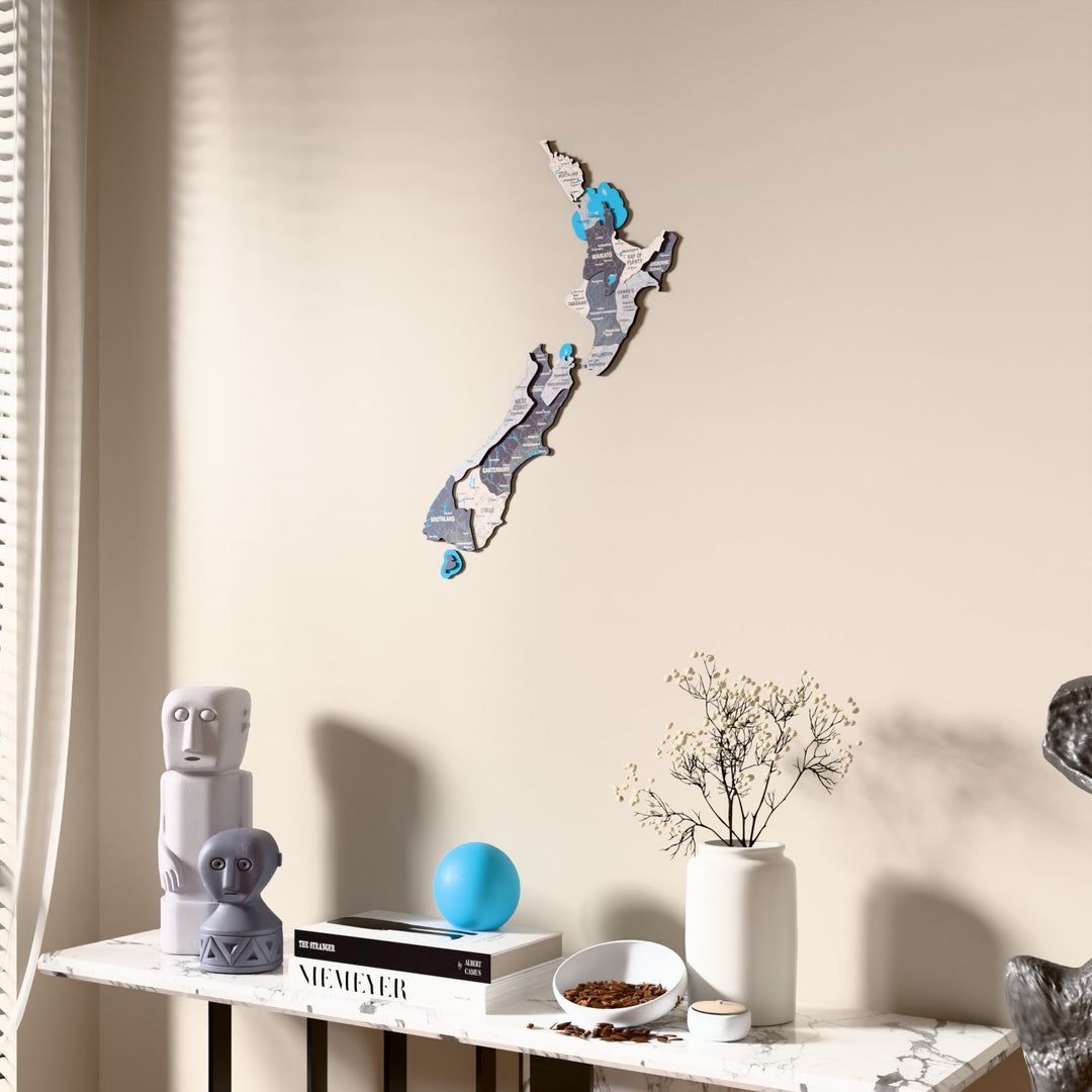 Nimbus New Zealand wooden wall map beside a sheer curtain, angled view