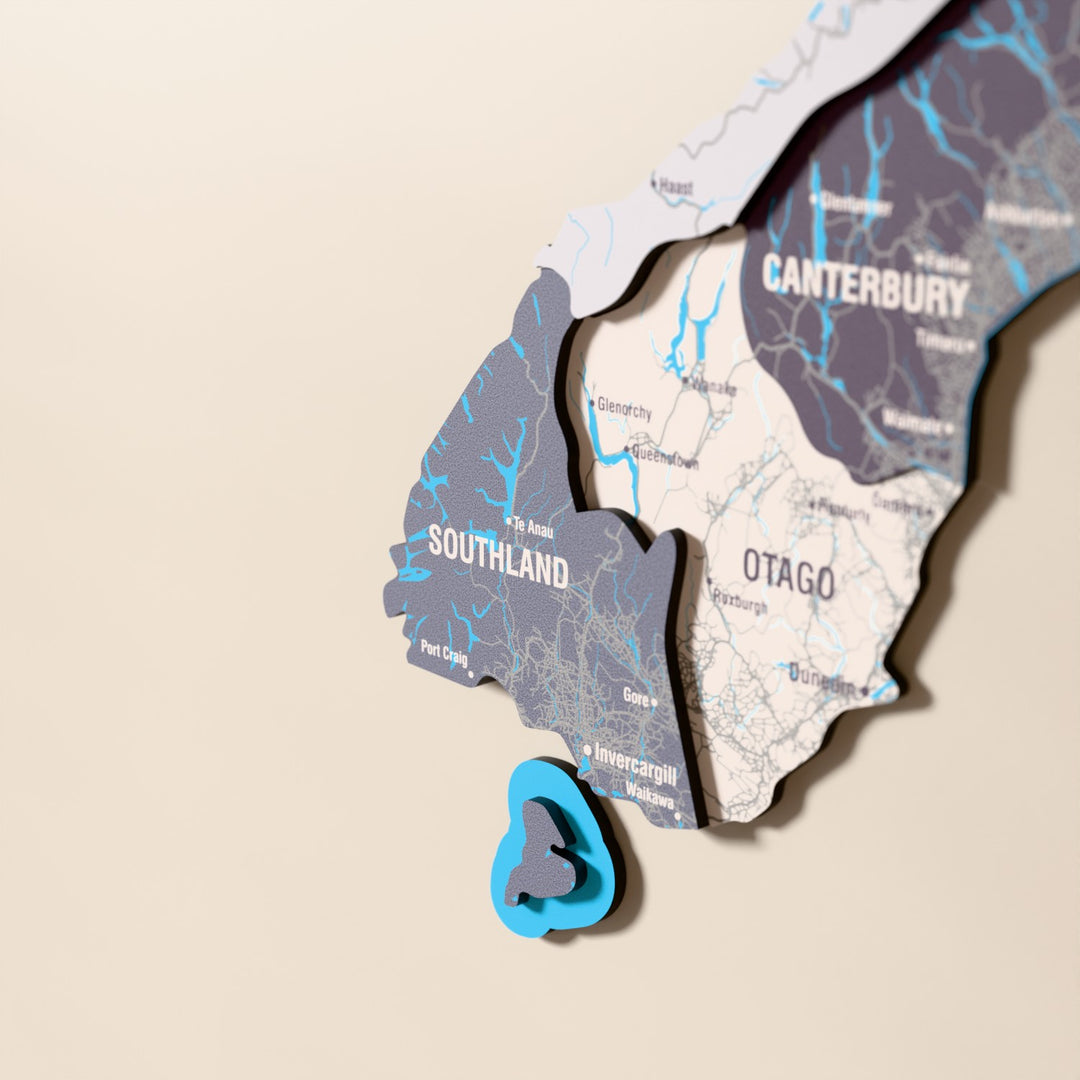 Close-up of the Nimbus New Zealand wooden wall map with layered regions and printed names