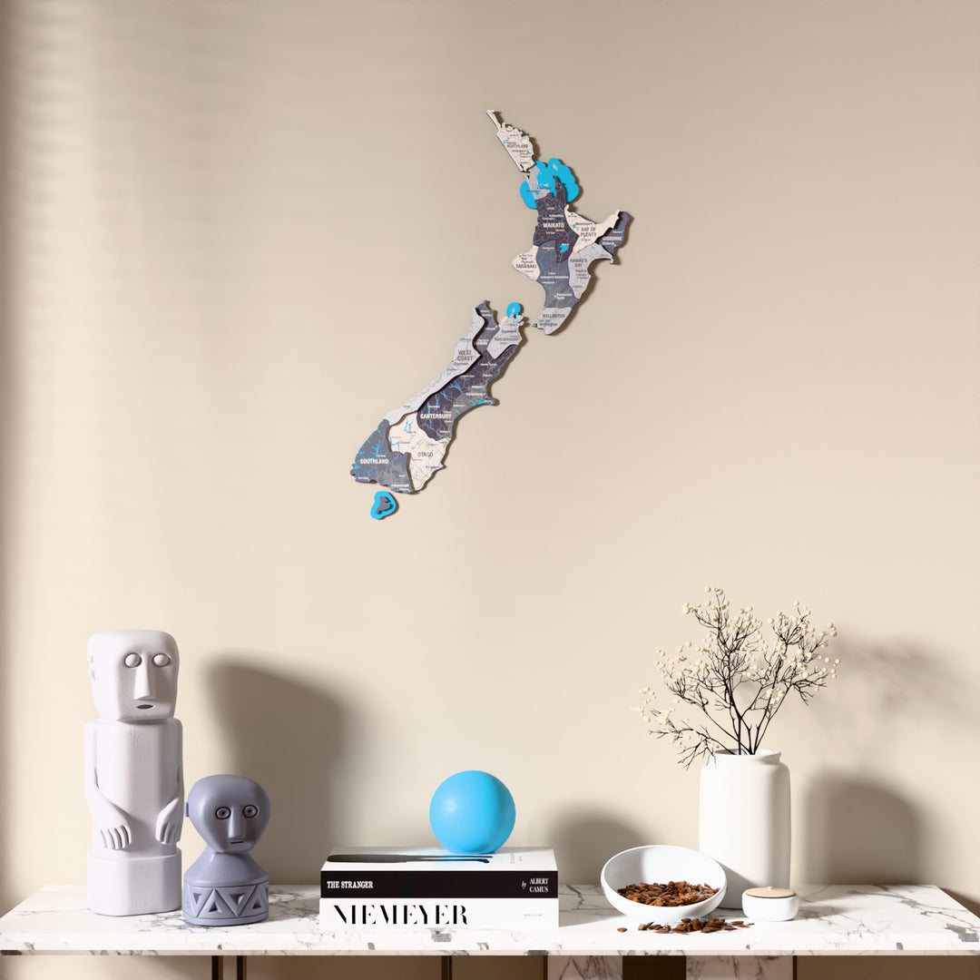 Nimbus New Zealand wooden wall map above a marble console, front view