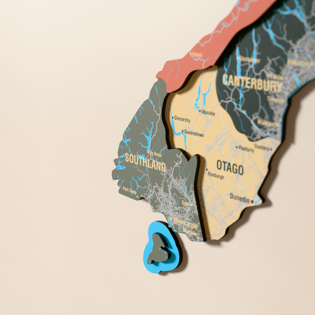 Close-up of the Sage New Zealand wooden wall map with layered regions and printed names