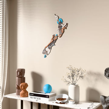 Soil New Zealand wooden wall map beside a sheer curtain, angled view