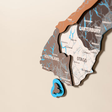 Close-up of the Soil New Zealand wooden wall map with layered regions and printed names