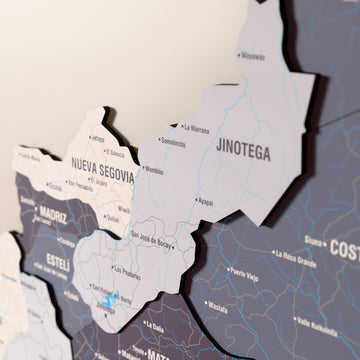 Close-up of the Nimbus Nicaragua wooden wall map with layered regions and printed names