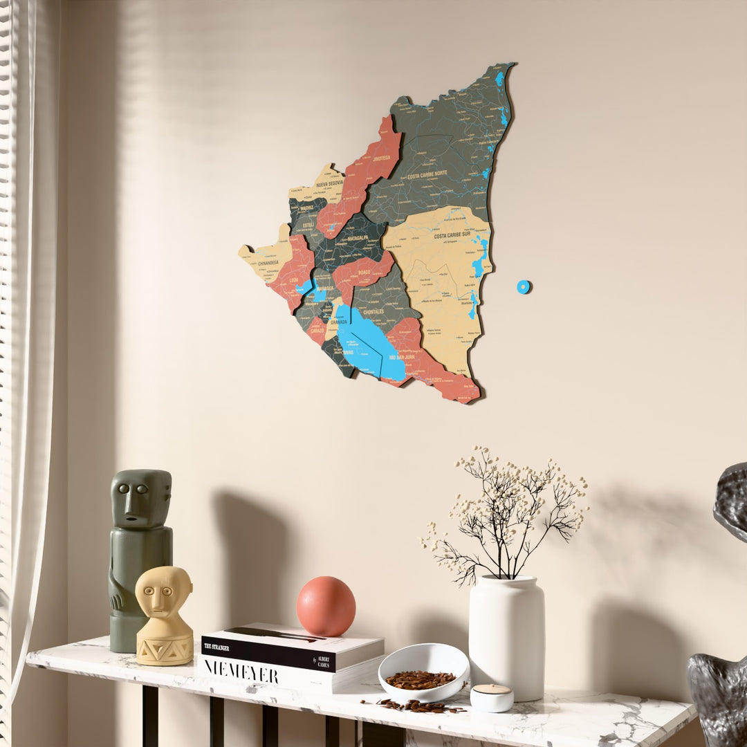 Sage Nicaragua wooden wall map beside a sheer curtain, angled view