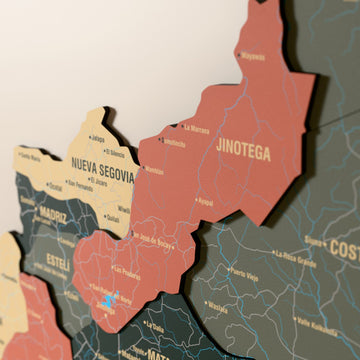 Close-up of the Sage Nicaragua wooden wall map with layered regions and printed names