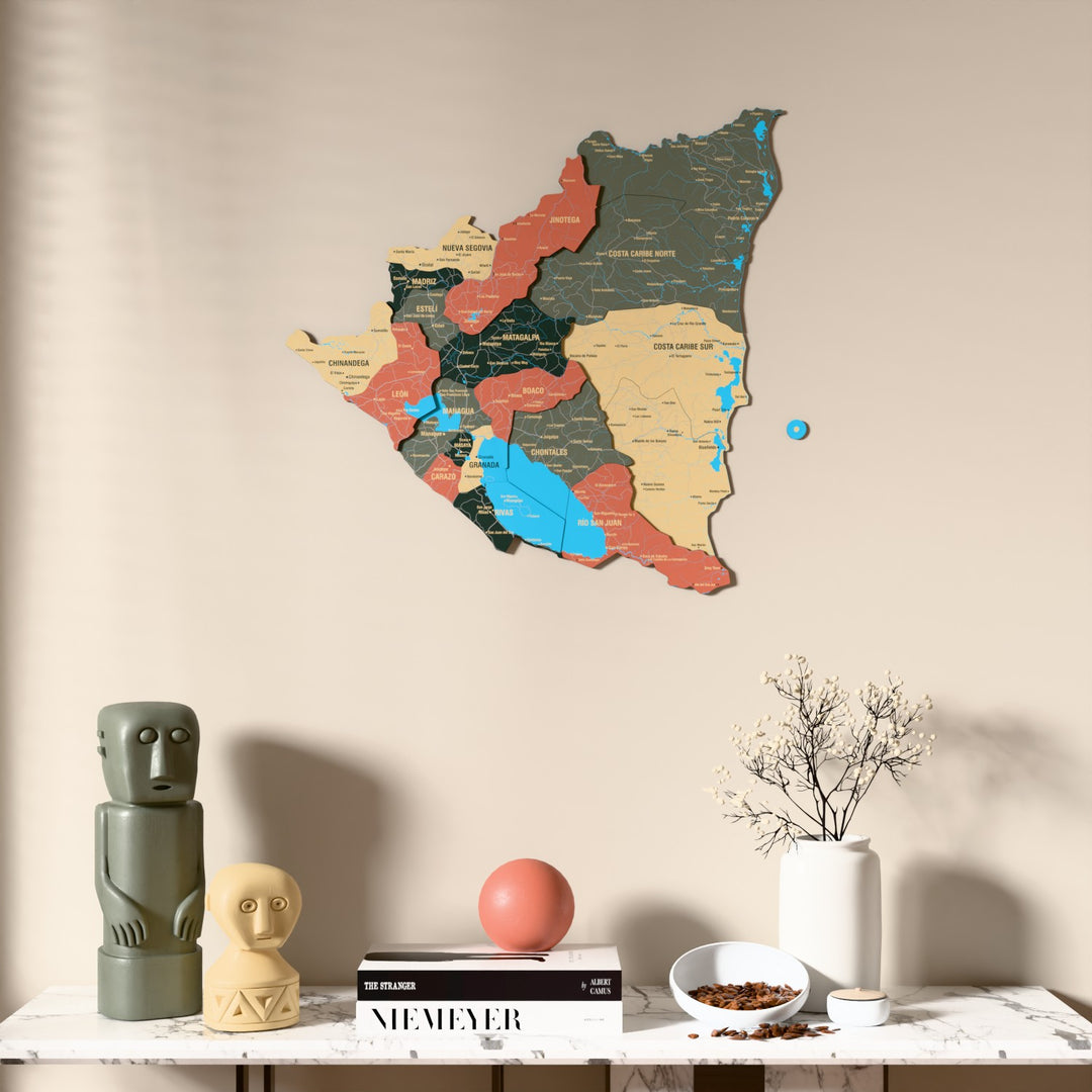 Sage Nicaragua wooden wall map above a marble console, front view