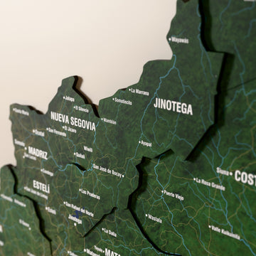 Close-up of the Satellite Nicaragua wooden wall map with layered regions and printed names