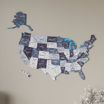 Nimbus wooden United States map in gray and purple shades, wide view with dried flowers at lower right
