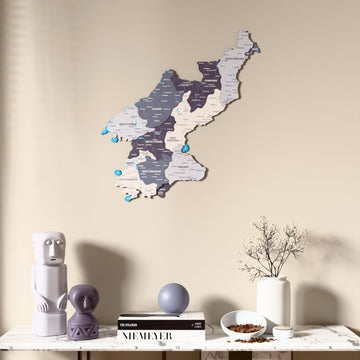 Nimbus North Korea wooden wall map above a marble console, front view