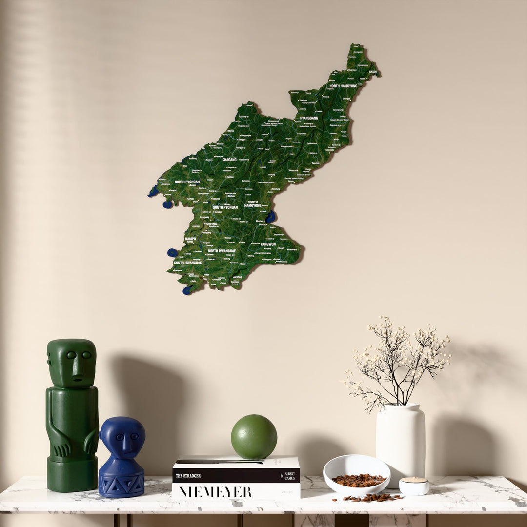 Satellite North Korea wooden wall map above a marble console, front view