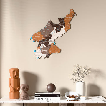 Soil North Korea wooden wall map above a marble console, front view