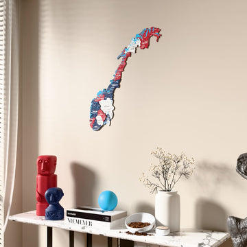 Flag colored Norway wooden wall map beside a sheer curtain, angled view
