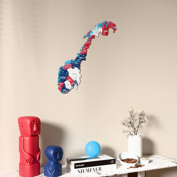 Flag colored Norway wooden wall map on a beige wall above a console with figurines
