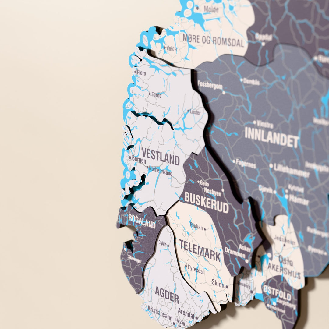 Close-up of the Nimbus Norway wooden wall map with layered regions and printed names