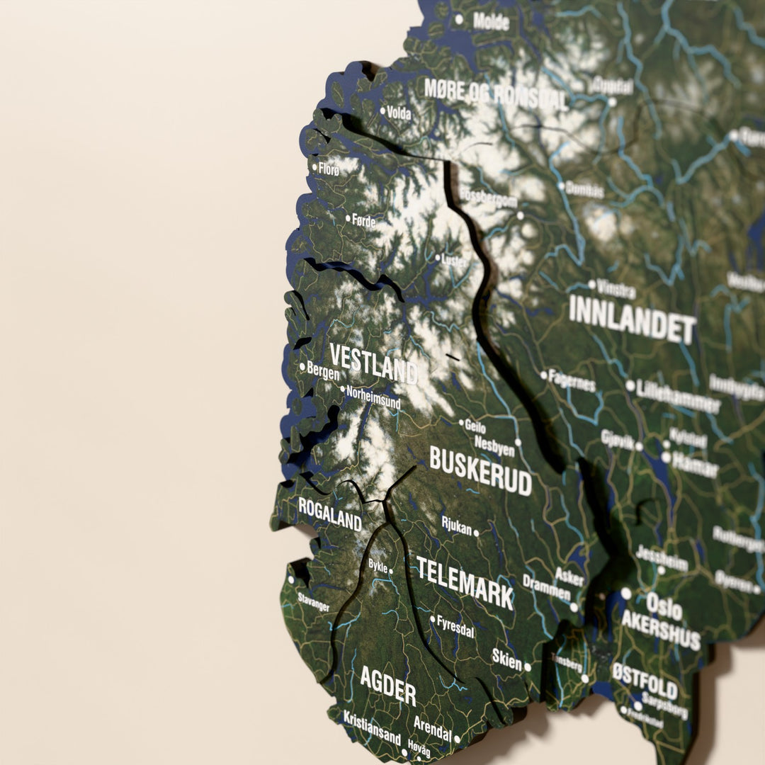 Close-up of the Satellite Norway wooden wall map with layered regions and printed names