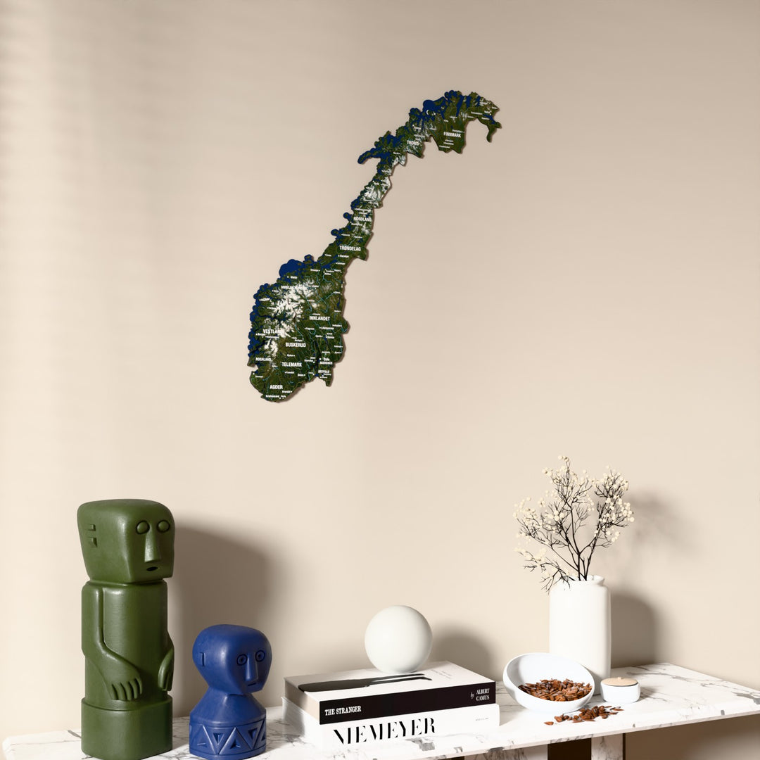 Satellite Norway wooden wall map on a beige wall above a console with figurines