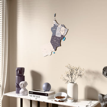 Nimbus Oman wooden wall map beside a sheer curtain, angled view