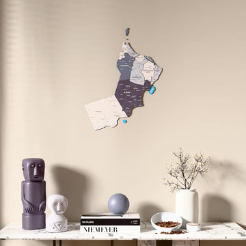 Nimbus Oman wooden wall map above a marble console, front view