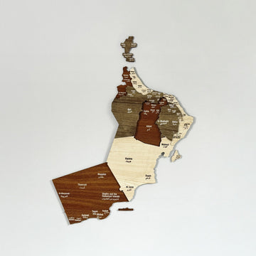 Oman wooden wall map in brown and beige layered wood, straight-on view against a plain white wall